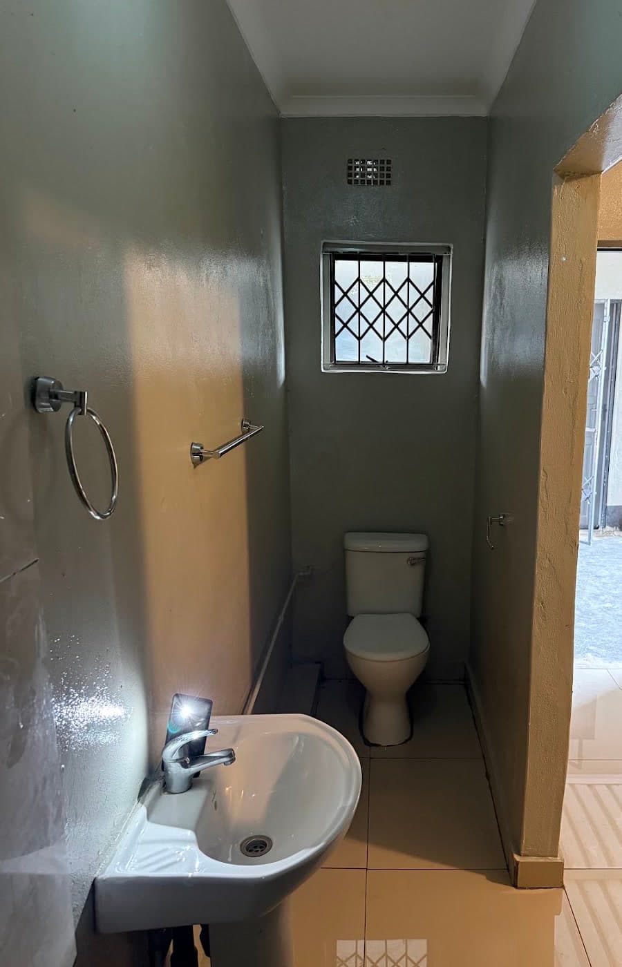 Example private en-suite layout with basin and toilet at Westrich