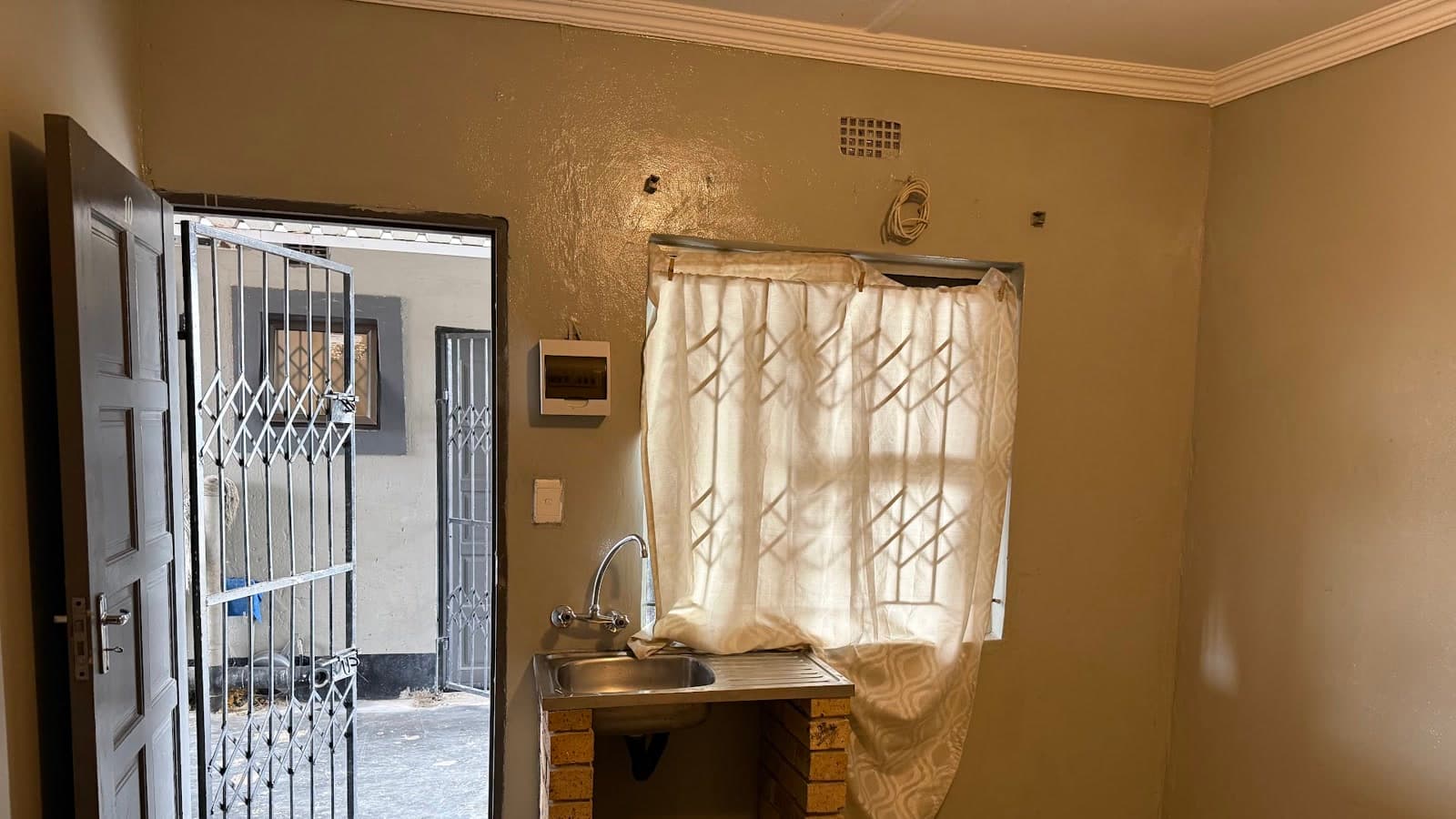 Example Westrich unit entrance, security gate and in-unit sink
